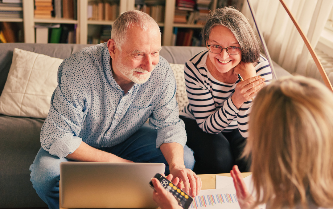 Business owners reviewing sale timing and market conditions with an advisor