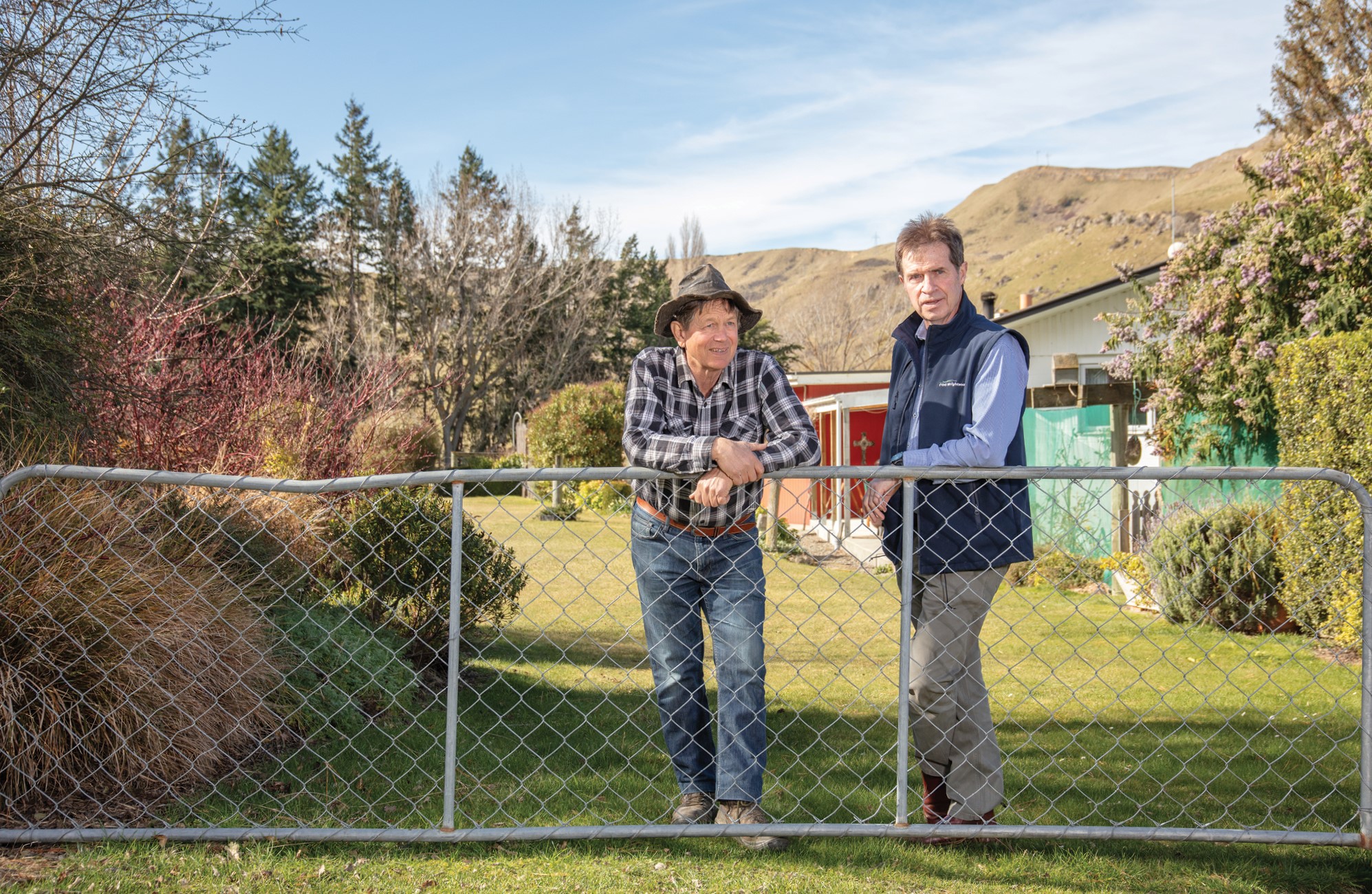PE_SPR25_Weka_leaning on fence
